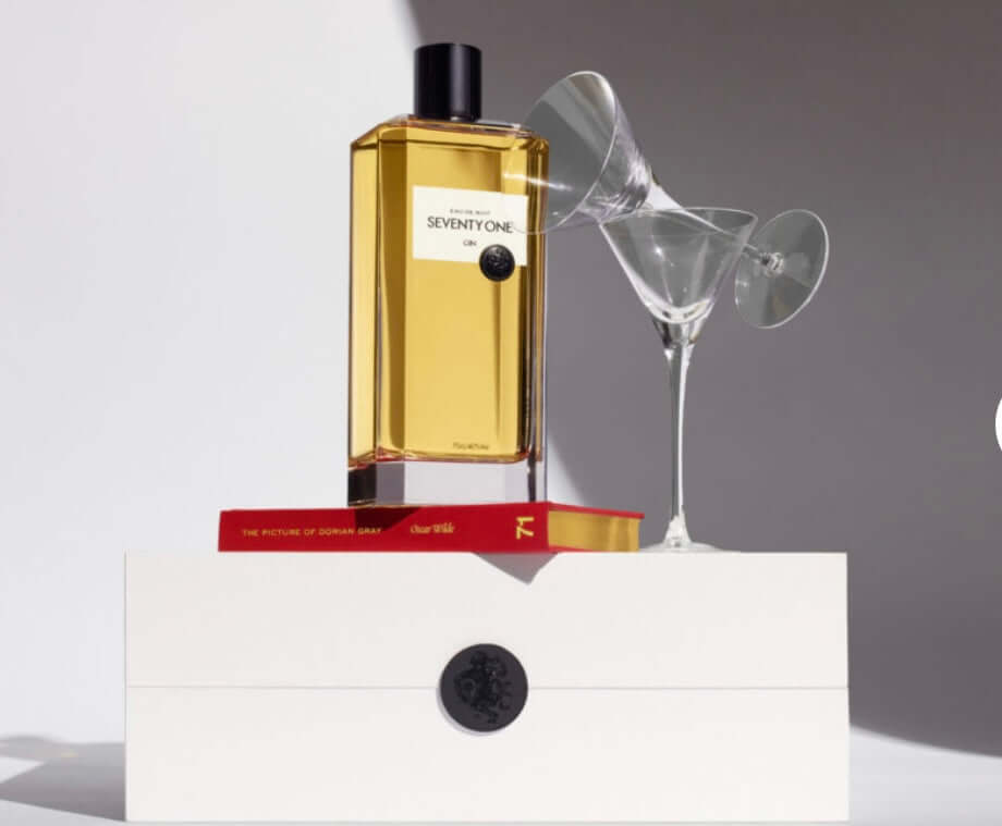 perfume-bottle-with-a-glass-on-a-white-surface