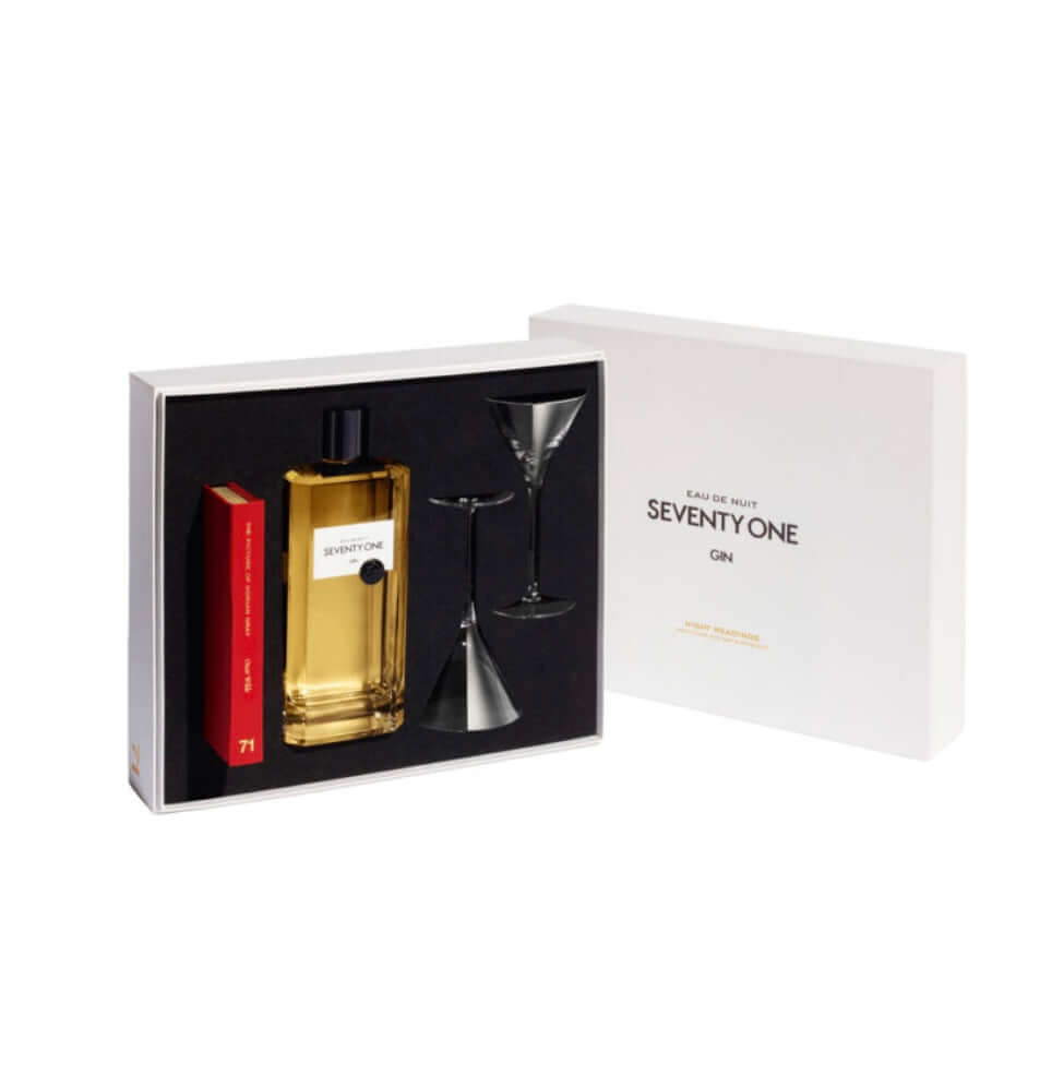 Gift set with a bottle of gin, two cocktail glasses, and a book inside a box labeled 'Seventy One Gin'.