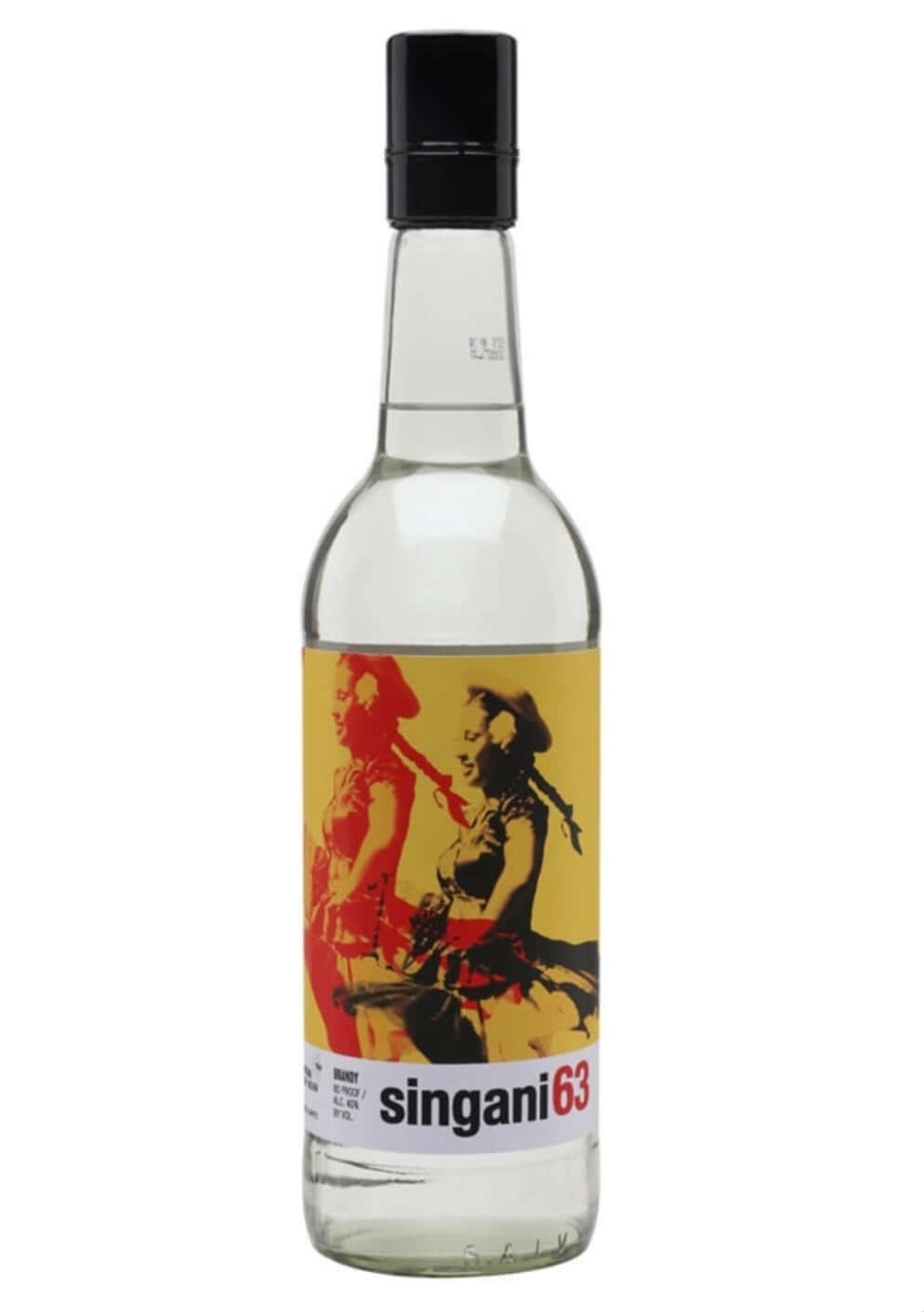 A clear glass bottle of singani63 liquor with a black cap and a yellow label featuring a red and black graphic illustration, set against a plain white background.
