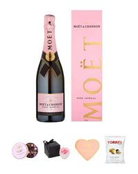 Moét & Chandon rose champagne bottle with packaging and snacks on a white background