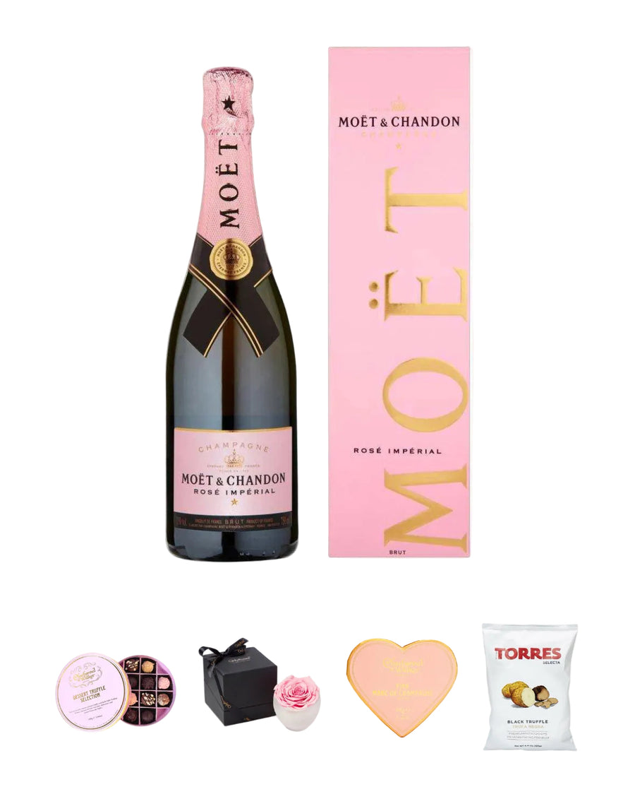 Moét & Chandon rose champagne bottle with packaging and snacks on a white background