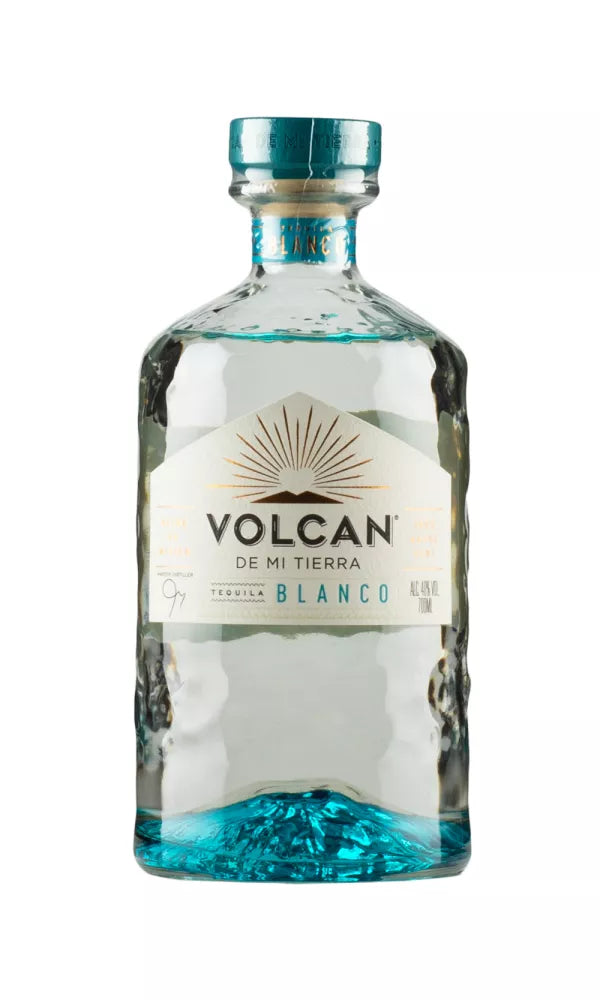 Sleek 70cl bottle of Volcan De Mi Tierra Blanco Tequila, 40% ABV, with a modern volcanic design. This clear tequila offers a fresh, agave-forward flavor with citrus notes.