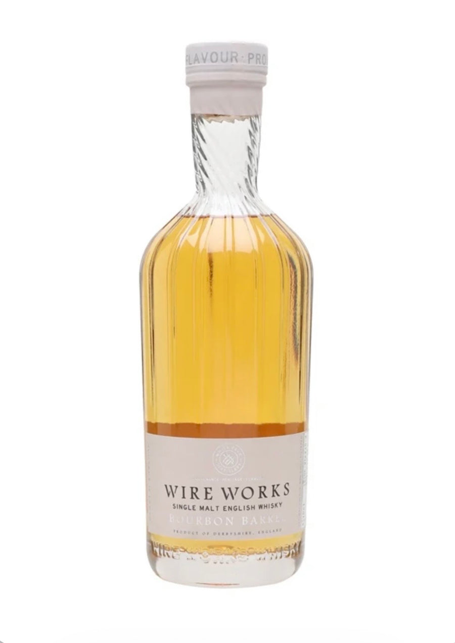 A bottle of Wire Works Single Malt English Whisky, featuring a clear glass bottle filled with golden amber whisky, a cream-colored label, and a white screw cap, set against a plain white background.