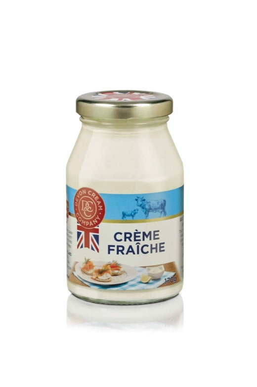 Jar of crème fraçèche with a label on a white background